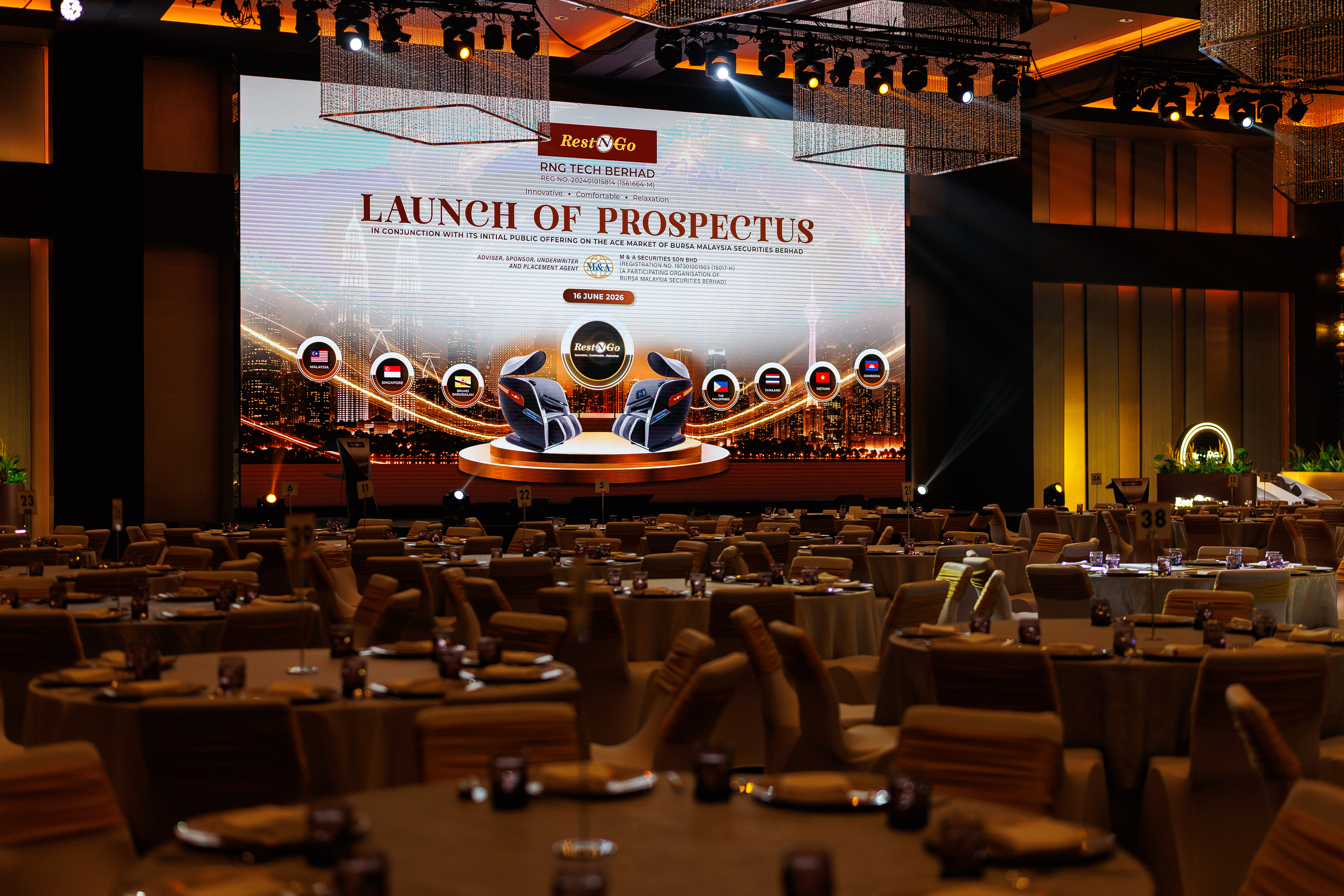 Rest N Go Tech Berhad prospectus launch event setup with large LED screen and banquet hall seating