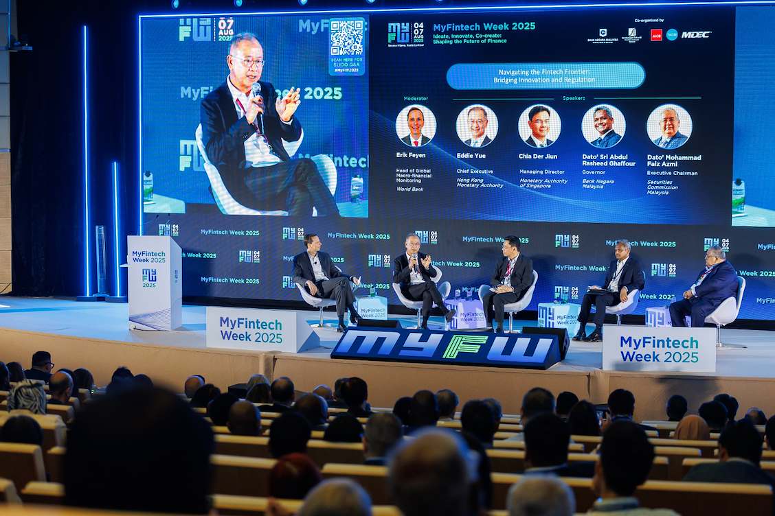 Above Creative Events managing a business conference at Fintech Week 2025, featuring 5 keynote speakers on a lit stage before a packed audience